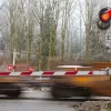 an image of a rail crossing and train